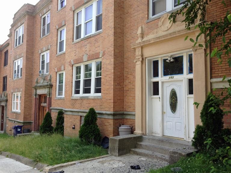 The Intervale Street apartment building in Roxbury where three people were fatally shot early Saturday morning. (Bruce Gellerman/WBUR)