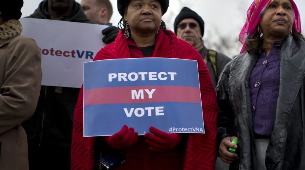 People wait in line outside the Supreme Court in Washington, Wednesday, Feb. 27, 2013, to listen to oral arguments in the Shelby County, Ala., v. Holder voting rights case. (Evan Vucci/AP)