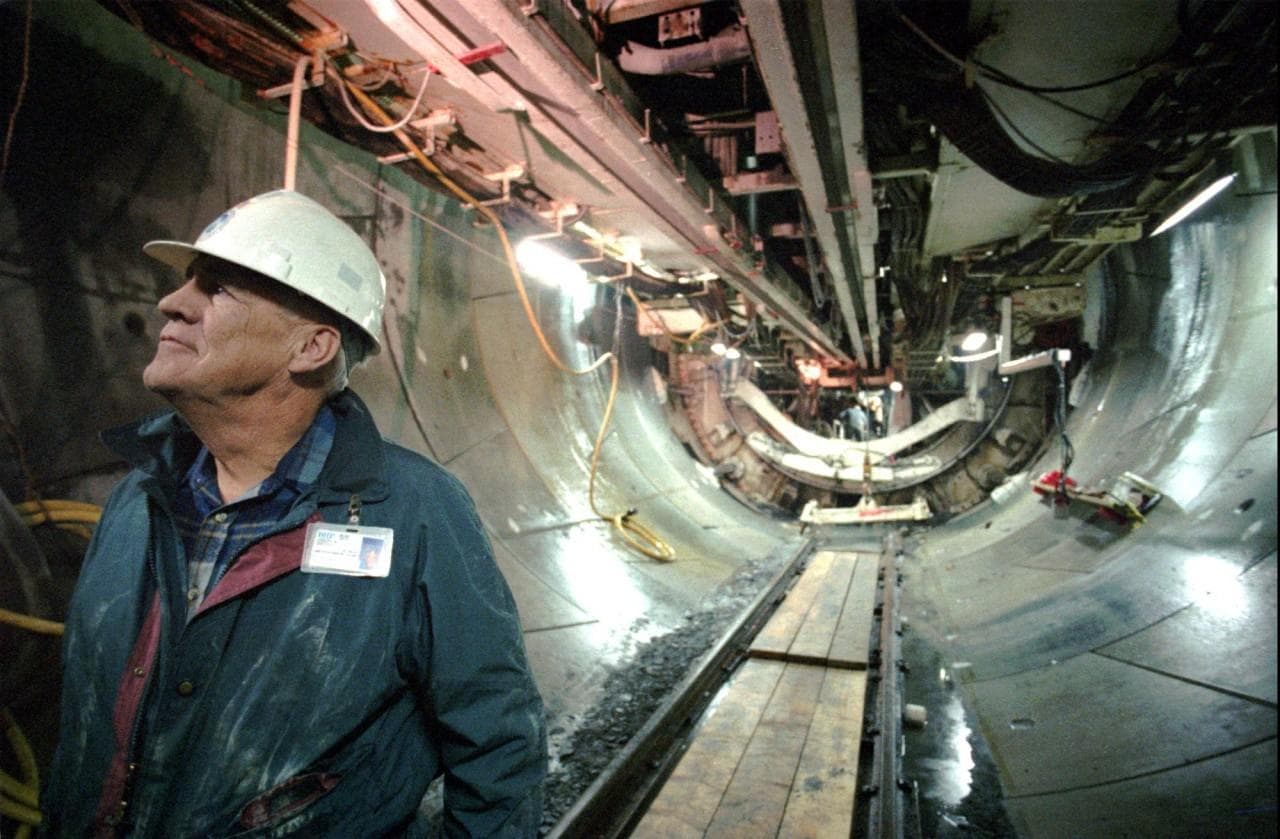 This is a 1992 file photo showing construction manager Joseph Griffith inside the Massachusetts Water Resources Authority's Outfall Tunnel, which will carry sewage more than nine miles underwater from Boston's Deer Island out into the Massachusetts Bay. The MWRA announced Friday morning, Sept. 20, 1996, that the tunnel was completed just before midnight and that the overall completion of the sewage project for operation is still two years away. (Paula Scully/AP)