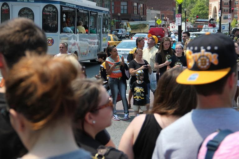 Young Bruins fans waited outside during game-day preparations. (Jared Bennett/ WBUR)