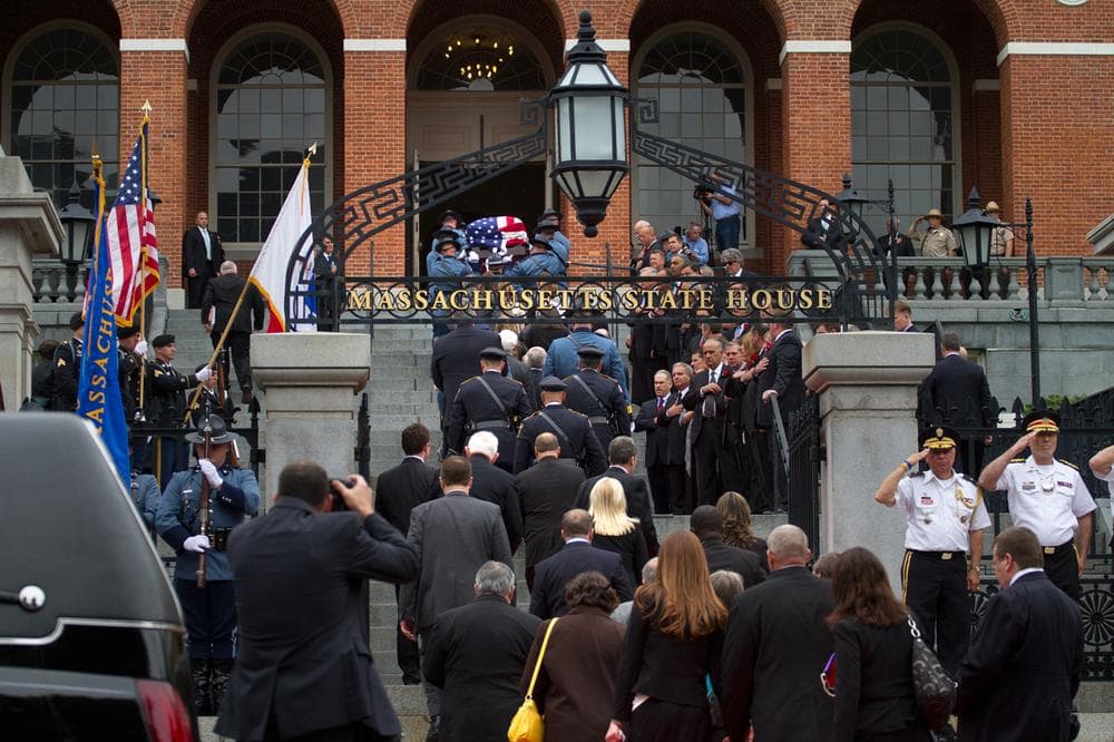 The late Paul Cellucci's casket is carried up the State House steps for a memorial service Thursday. (Jesse Costa/WBUR)