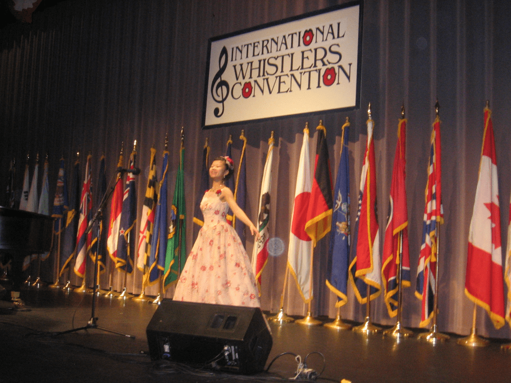 Begowned performer--Dressed for Success: Dressing up for the competition adds to the "presentation" component.  That helped  fourteen year-old Marina Kato to this year's grand championship in the female teen division. (Ron Schachter/Only A Game)  
