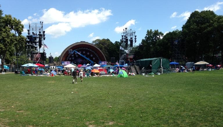People start to gather at the Hatch Shell in the morning. (Lynn Jolicoeur/WBUR)