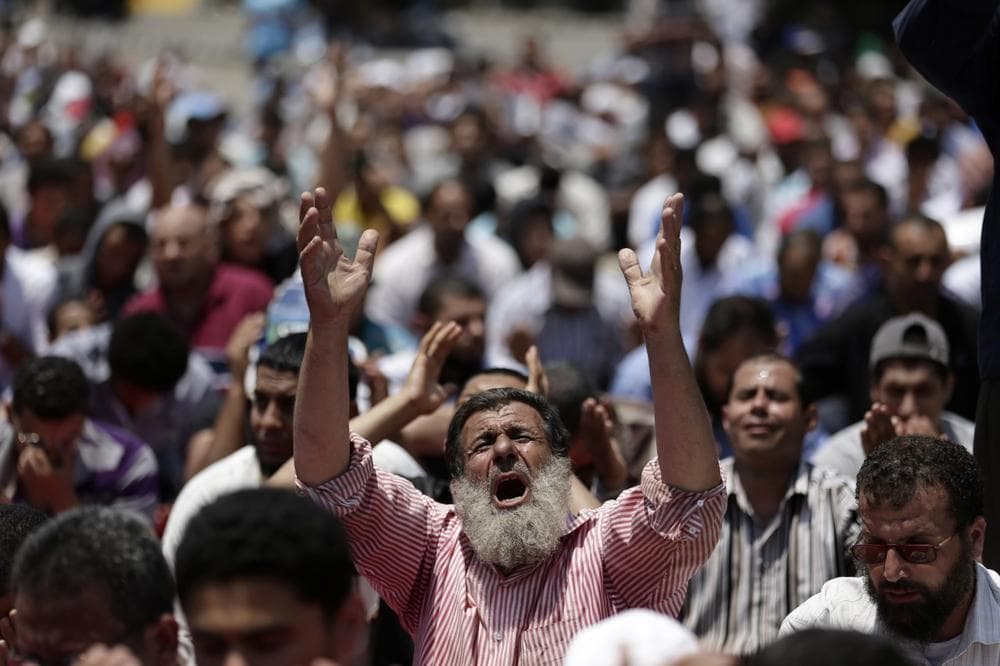 Supporters of ousted Egyptian President Mohammed Morsi pray during the Friday prayer before a protest near the University of Cairo, Giza, Egypt, Friday. (AP)