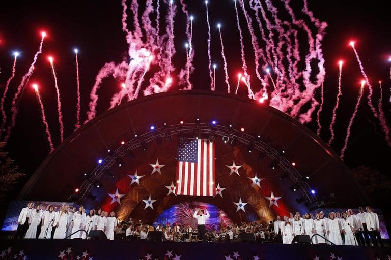 Fireworks burst over the Hatch Shell during the finale of the Boston Pops Fourth of July Concert in Boston, Thursday, July 4, 2013. (Michael Dwyer/AP)