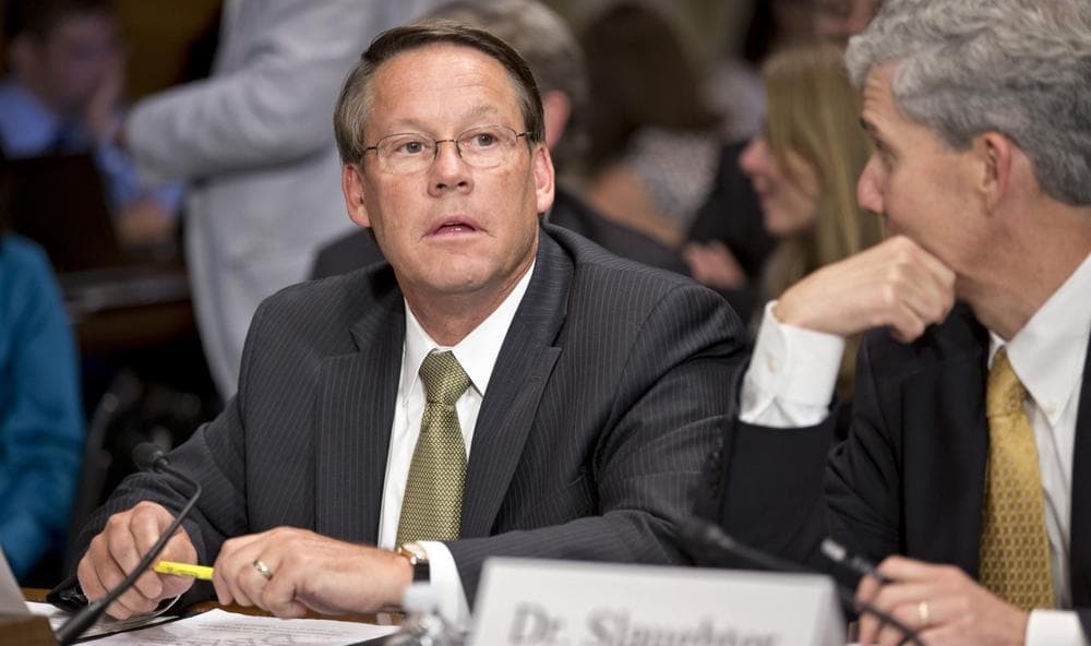 Smithfield Foods CEO Larry Pope takes his seat on Capitol Hill in Washington, Wednesday, July 10, 2013, before the start of a Senate Agriculture Committee hearing on the pending sale of Smithfield to China's largest meat producer. (J. Scott Applewhite/AP)