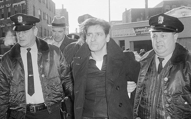 Albert DeSalvo, 35, is surrounded by police after his capture in Lynn on Feb. 25, 1967. DeSalvo was nabbed in a store a day after he escaped from Bridgewater State Hospital for the criminally insane. (AP)