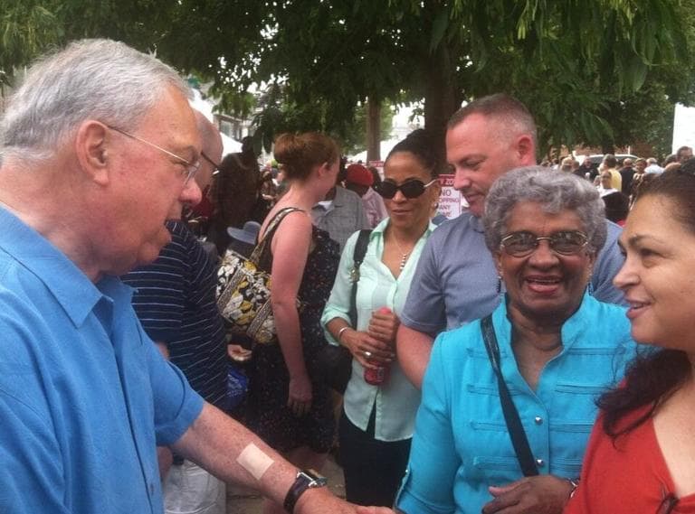 Mayor Menino greets supporters at his 20th block party. (Fred Thys/WBUR)