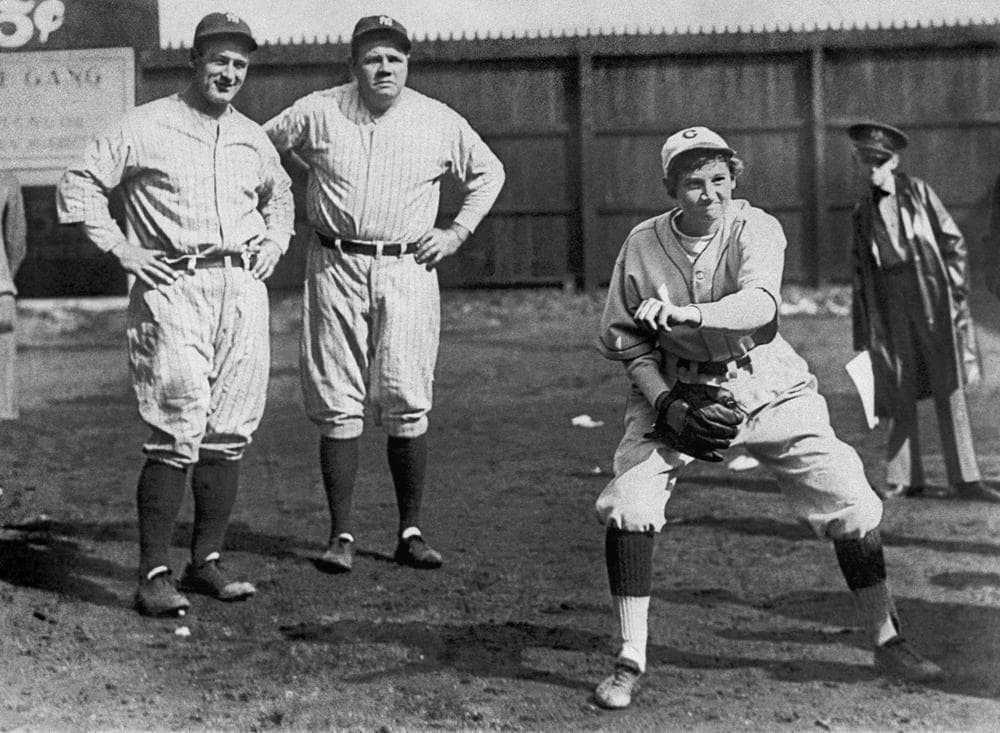 The two lengendary Yankees watch Jackie Mitchell throw. (AP)