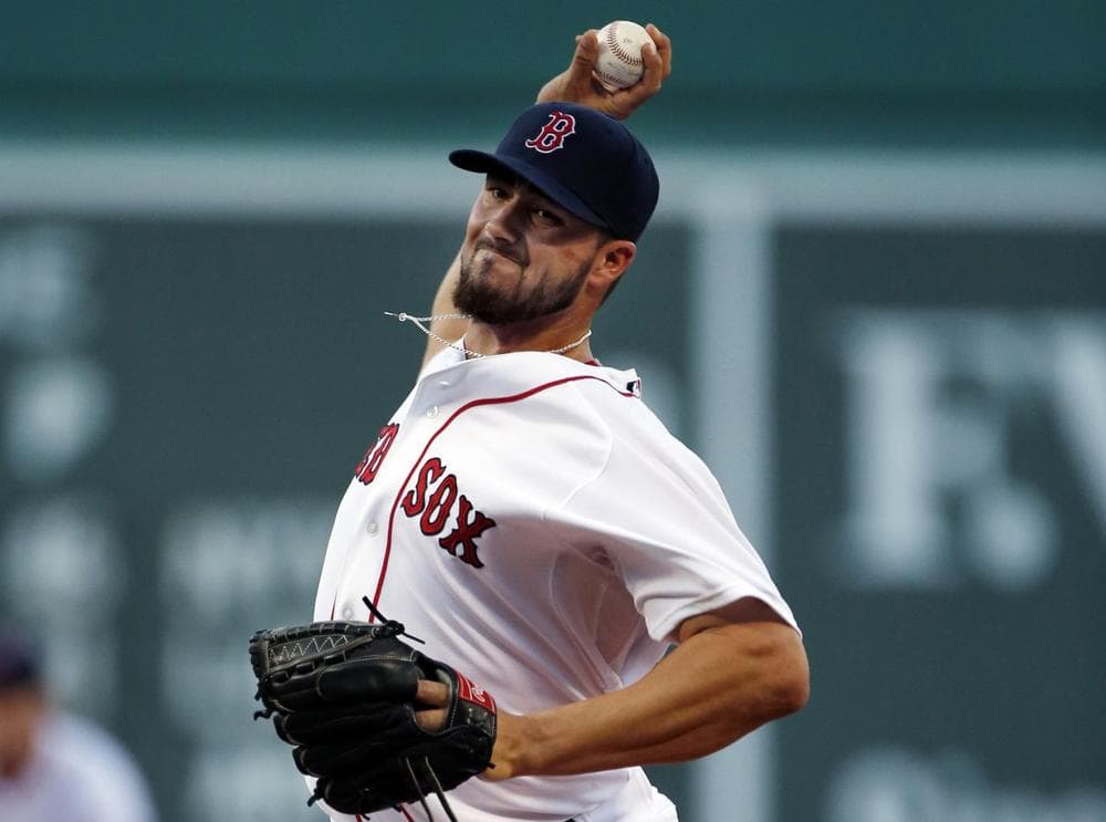 Boston Red Sox relief pitcher Brandon Workman delivers to the Seattle Mariners during the first inning of a baseball game at Fenway Park. (AP/Elise Amendola)