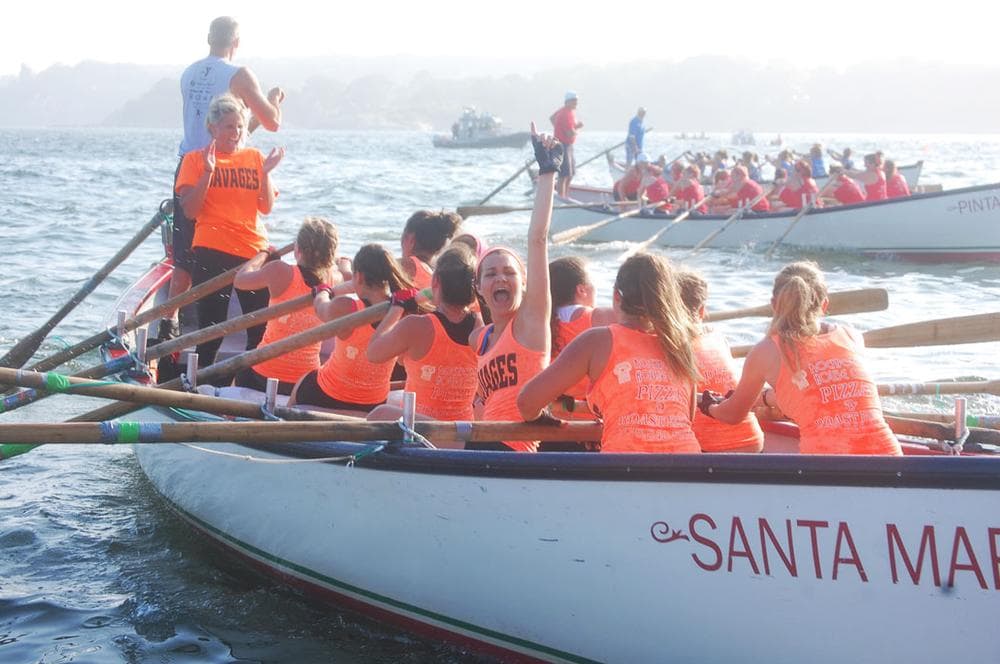 The rowing team Savages celebrates its victory in the junior women’s seine boat championship on Friday evening. (Greg Cook)