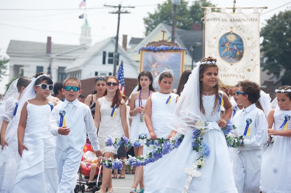 Children honor the Madonna of the Annunciation during Sunday’s religious procession that winds around Gloucester’s downtown. (Greg Cook)
