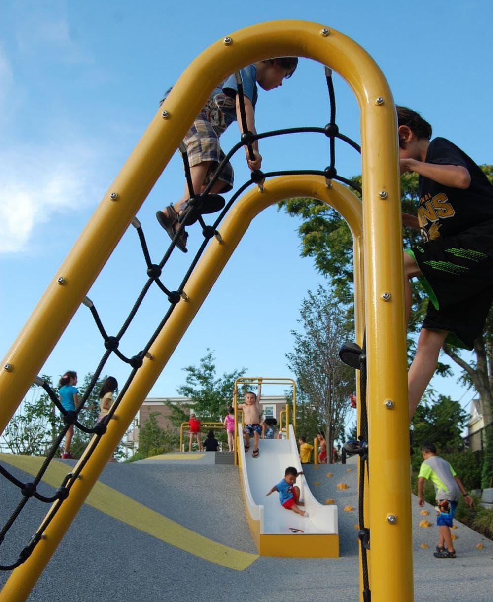 Children scale a rope net. (Greg Cook)