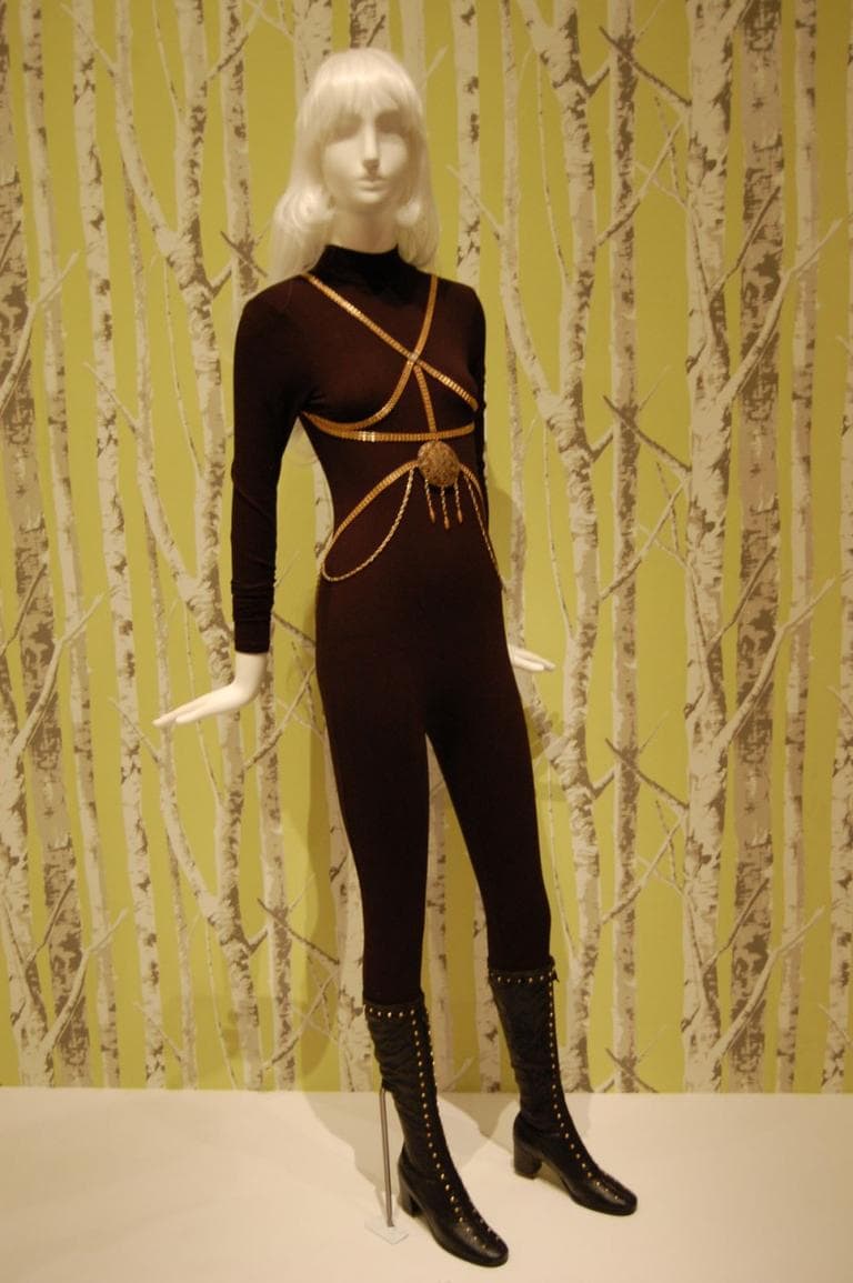 Carl Schimel’s circa 1969 base metal “Chastity Belt”—displayed here atop a black bodystocking—imitates medieval designs in its erotic chains and medallion (“a container meant to hold birth control pills,” according to the MFA).  (Greg Cook)