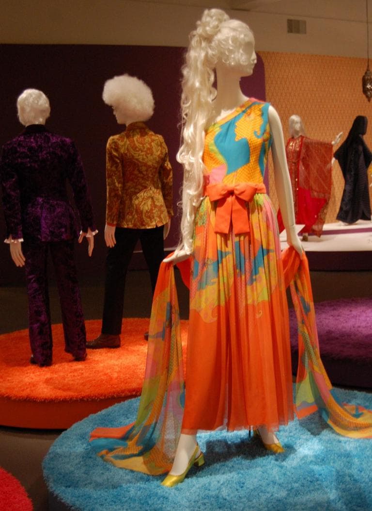 Hanae Mori creates a psychedelic version of a 1950s or ‘60s party frock with the bright orange fabrics and profile of a face printed across this late ‘60s chiffon evening jumpsuit ensemble. (Greg Cook)