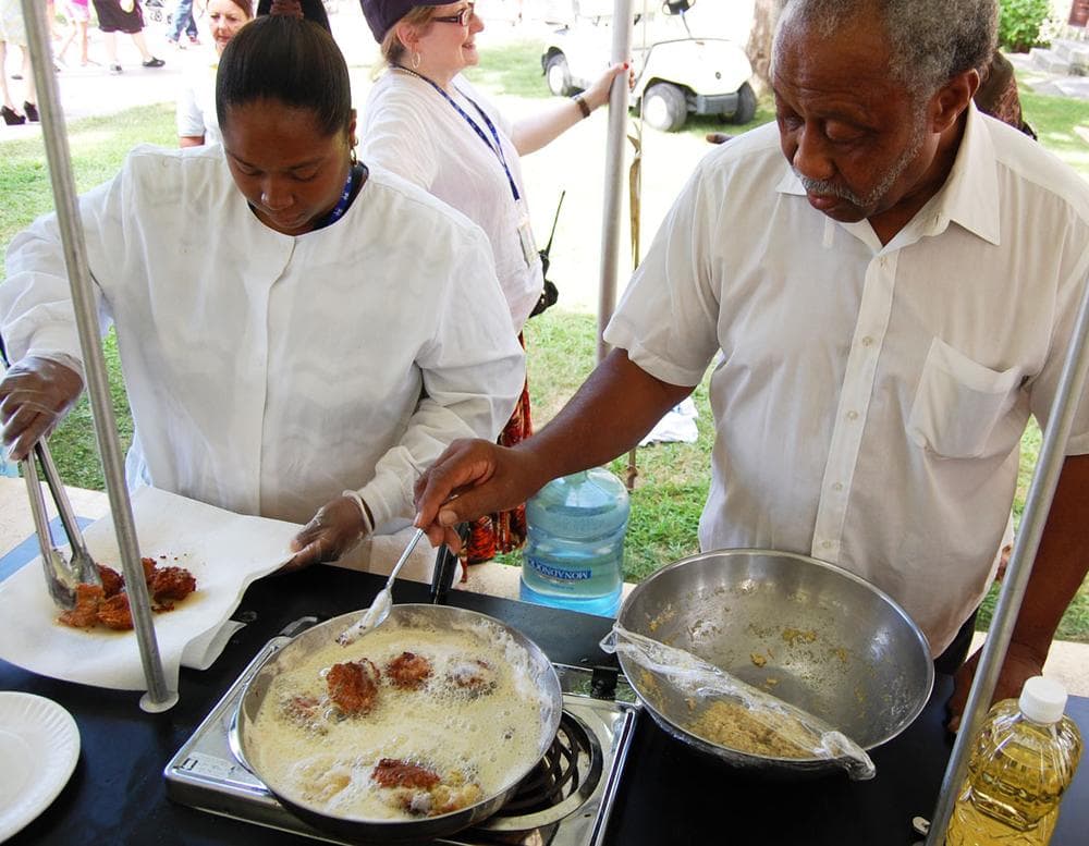 I just picked it up at home, seeing people cooking,” says Garrison Pollard of Holyoke, who was cooking up Southern-style hushpuppies with his daughter Lilly Morales in the fried dough demonstration tent. (Samples were free.) “I see something I wanted, I cook it. When I started, I didn’t have no recipe.” (Greg Cook)