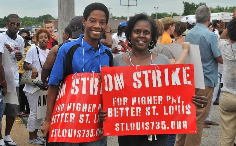 Rasheen Aldridge and Ruby Edwards demonstrate in front of McDonald's on W. Florissant Ave. in St. Louis. (Kate Sheets/Facebook)