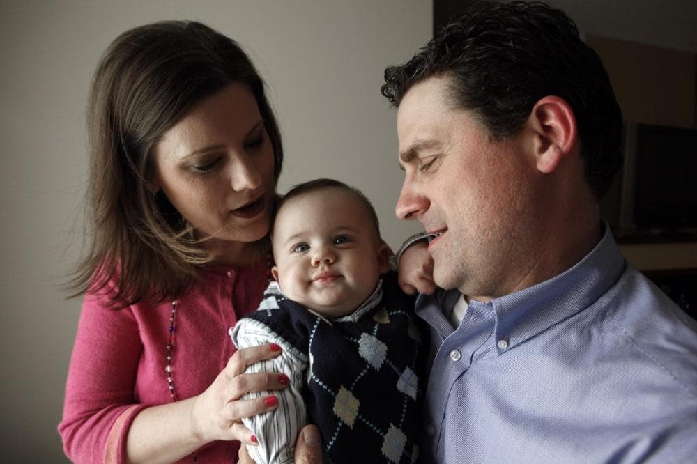 Shannon and Paul Morell with their 7-month-old son, Logan. (Paul Sancya/AP)