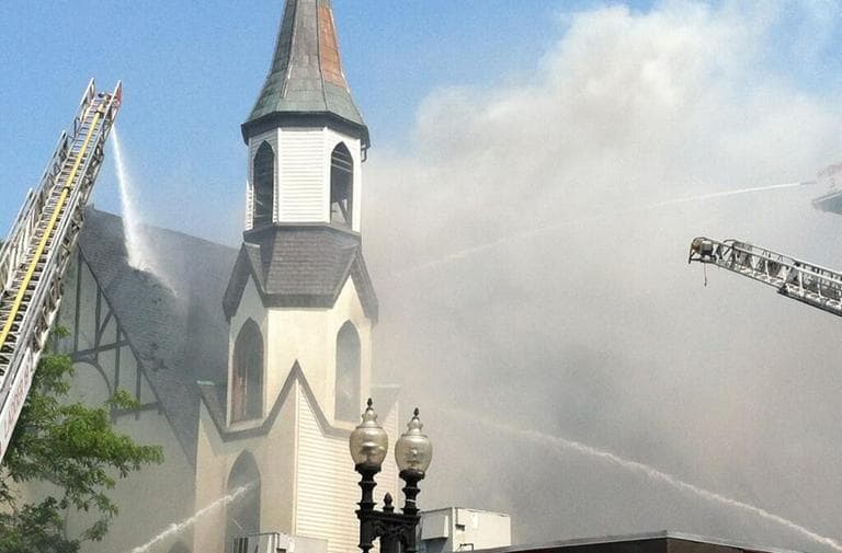 Firefighters work to quell Wednesday's fire at St. John the Baptist Albanian Orthodox Church in South Boston. (Jack Lepiarz/WBUR)