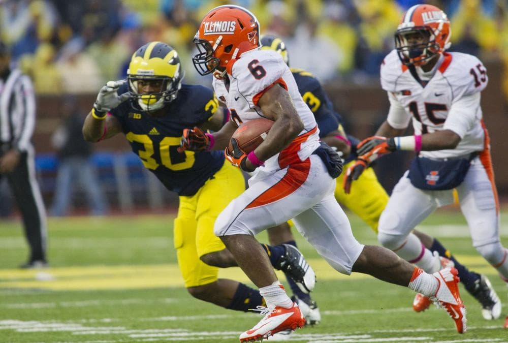Here &amp; Now producer/director Alex Ashlock likes it when the Illinois Fighting Illini beat the Michigan Wolverines. (Tony Ding/AP)
