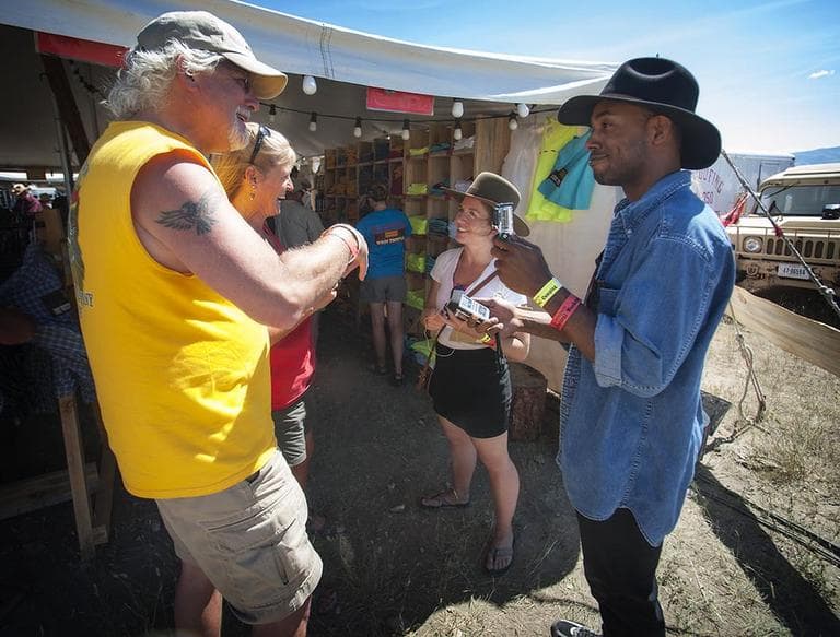MBAs Across America teammates Amaris Singer (center) and Casey Gerald (right) interview Red Ants Pants customers in White Sulphur Springs, Mont. (Courtesy)