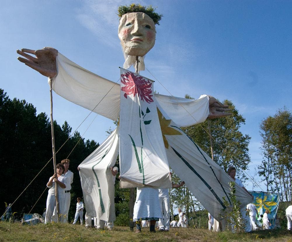 A giant earth goddess rises atop a hill. (Greg Cook)