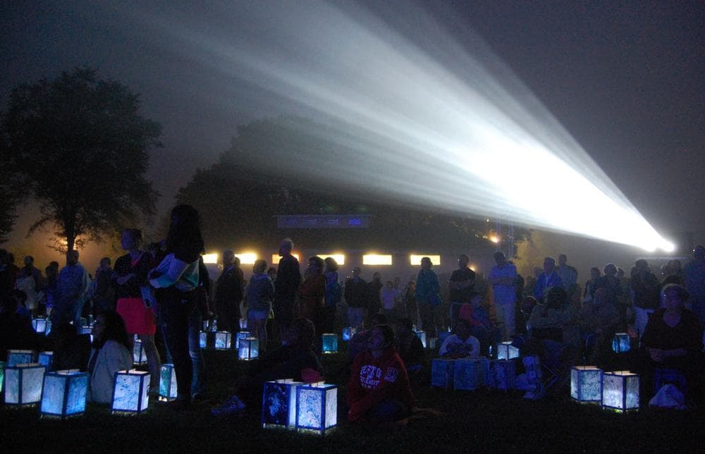 Hundreds gathered on the lawn of South Boston’s Castle Island Park in August 2013 for a screening and lantern walk organized by Medicine Wheel to mark the 50th anniversary of Martin Luther King Jr. delivering his “I Have a Dream" speech. (Greg Cook)