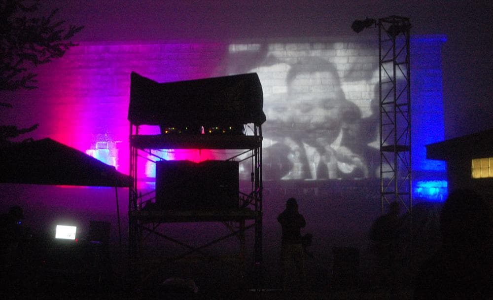 Footage of King delivering his "I Have a Dream" speech is projected onto Fort Independence's wall. (Greg Cook)