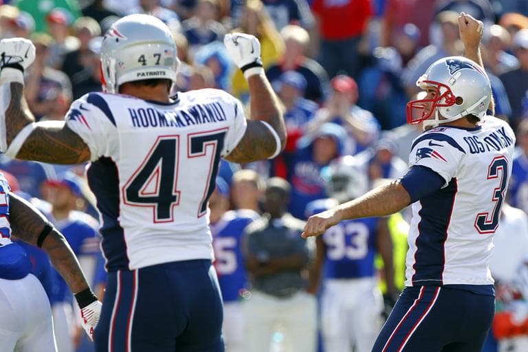 New England Patriots kicker Stephen Gostkowski, right, celebrates with teammate Michael Hoomanawanui (47) after kicking the game winning field goal during the second half of an NFL football game against the Buffalo Bills Sunday, Sept. 8, 2013, in Orchard Park. The Patriots won the game 23-21.(Bill Wippert/AP)