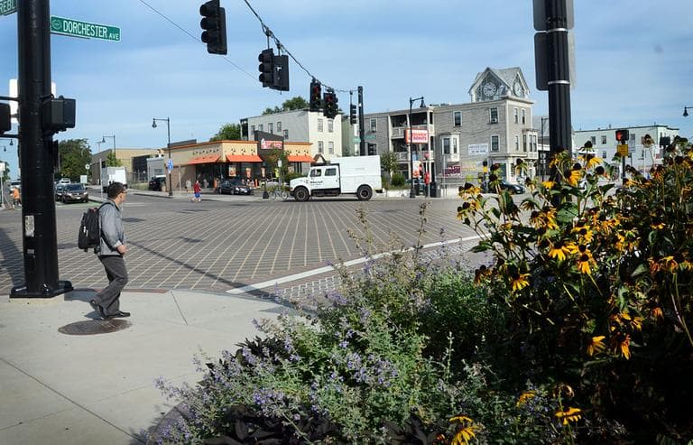 Peter Szyjka says when he started his law firm on Dorchester Avenue eight years ago, the neighborhood looked a lot different. “There was no flower pots. There was no greenery. There was no nice grid on the crosswalks.” (Robin Lubbock/WBUR)