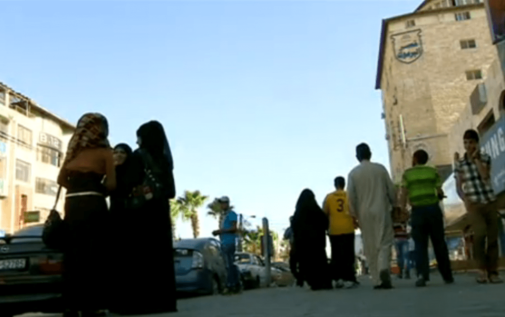 The BBC's Yolande Knell reports that one in three people in Irbid, Jordan, now is Syrian. (Screenshot from BBC video)
