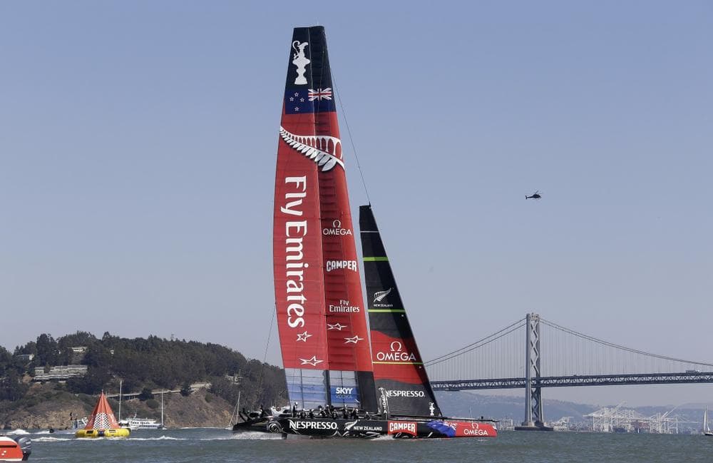 Emirates Team New Zealand passes the finish line to win the seventh race of the America's Cup against Oracle Team USA on September 12, 2013 in San Francisco, CA. (Eric Risberg/AP)