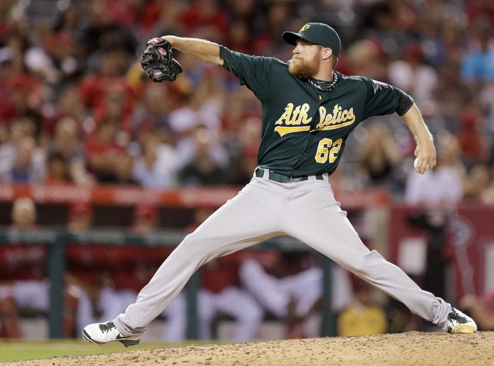Oakland Athletics pitcher Sean Doolittle throws one home. (Chris Carlson/AP)
