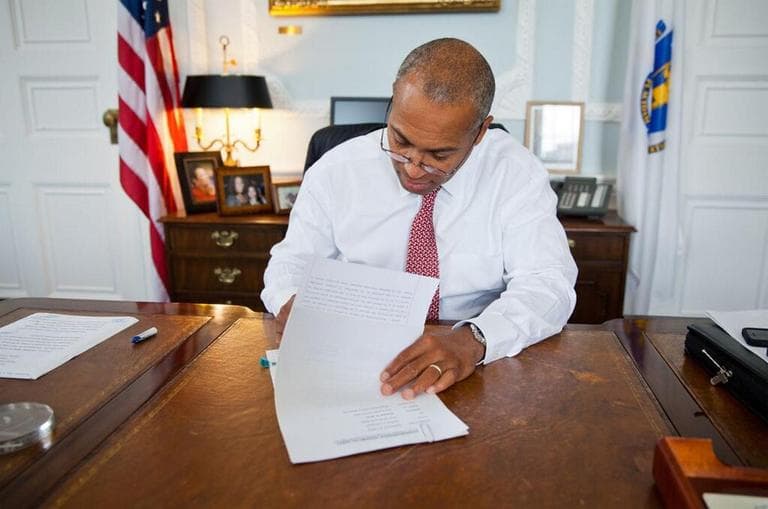 Gov. Deval Patrick signs the software tax repeal Friday. (Governor's Office)