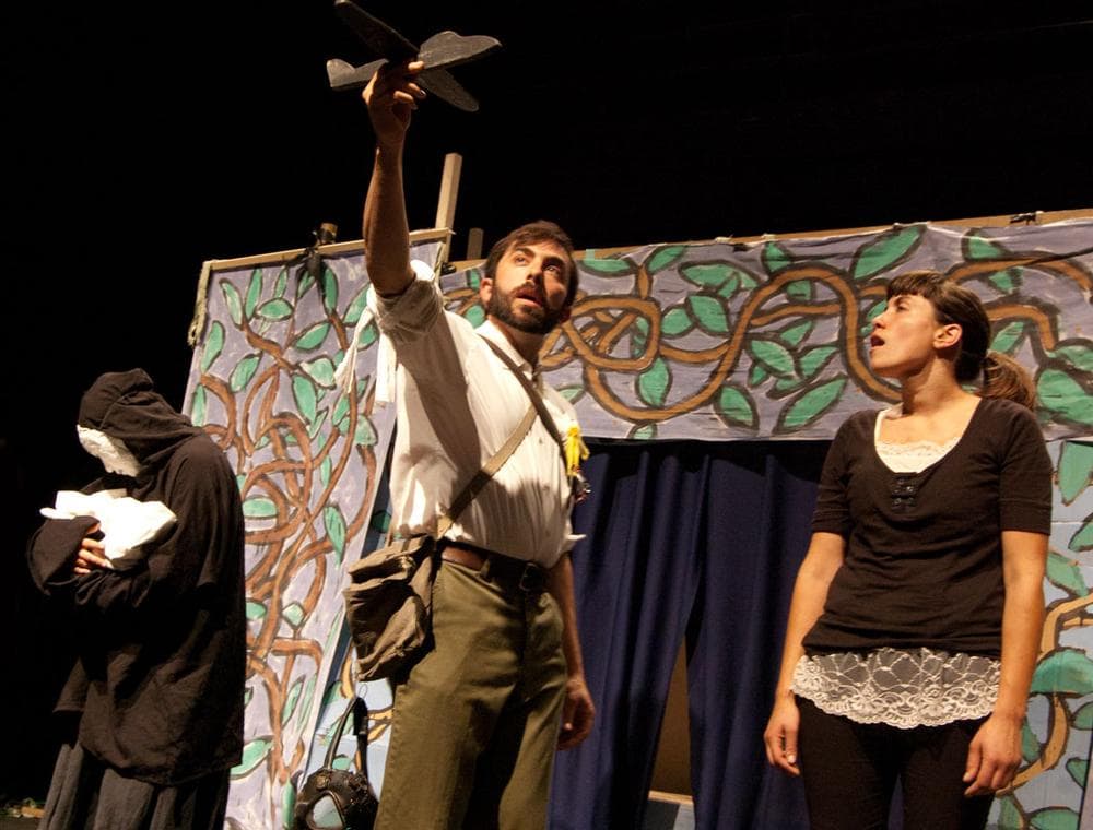 A soldier's bomber plane threatens a Vietnamese mother in Bread and Puppet Theater's revival of its 1965 anti-war show "A Man Says Goodbye to His Mother" at Boston College. (Greg Cook)