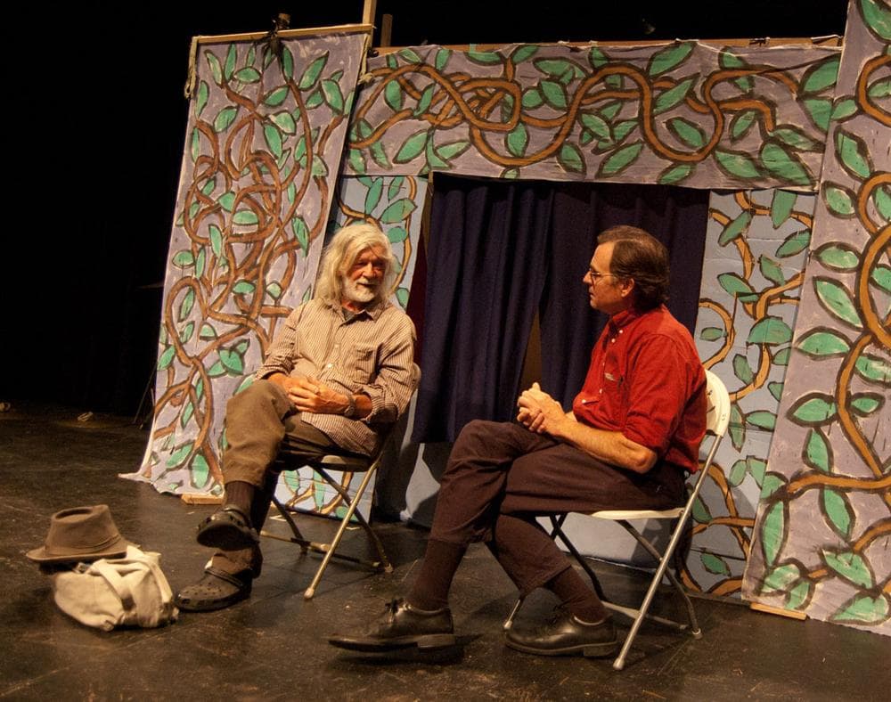 Peter Schumann (left) speaks with John Bell at Boston College. (Greg Cook)