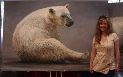 Anni Crouter poses with her painting at ArtPrize, an art competition in Michigan. The shutdown means that her work will be displayed outside the Gerald R. Ford Presidential Library and Museum. (ArtPrize)