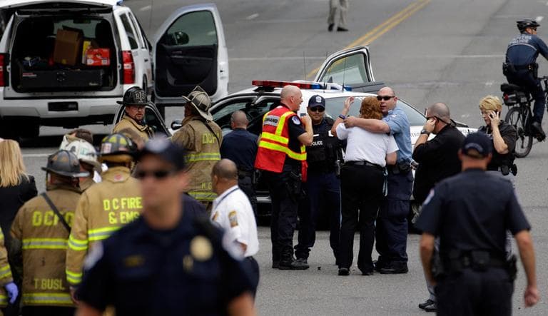 Police gather near the scene on Capitol Hill Thursday, after gunshots were heard. (Alex Brandon/AP)