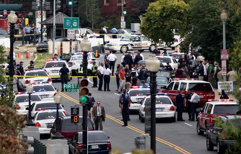 This view from the Russell Senate Office Building shows police converging on the scene of a shooting on Constitution Avenue. (J. Scott Applewhite/AP)
