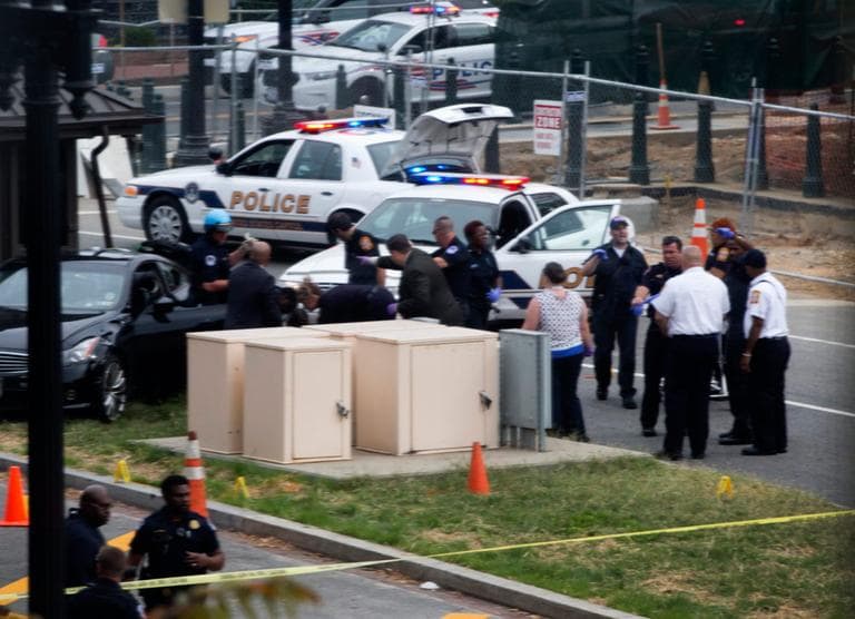 Emergency personal help an injured person after a shooting on Capitol Hill Thursday. (Evan Vucci/AP)