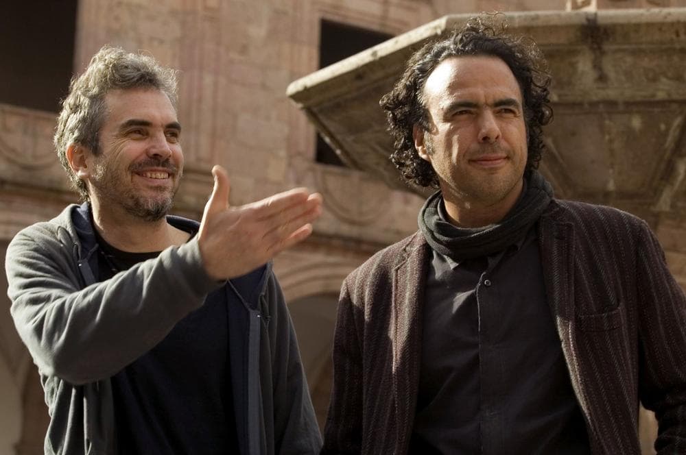 Mexican film directors Alfonso Cuaron, left, and Alejandro Gonzalez Inarritu pose for photographers at the Clavijero Palace during the 5th Morelia Film Festival in Morelia, Mexico.(Guillermo Arias/AP)