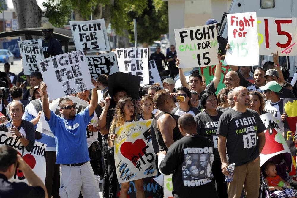 Protestors demonstrate outside a fast food restaurant on Thursday, Aug. 29, 2013, in Los Angeles. (AP/Nick Ut)