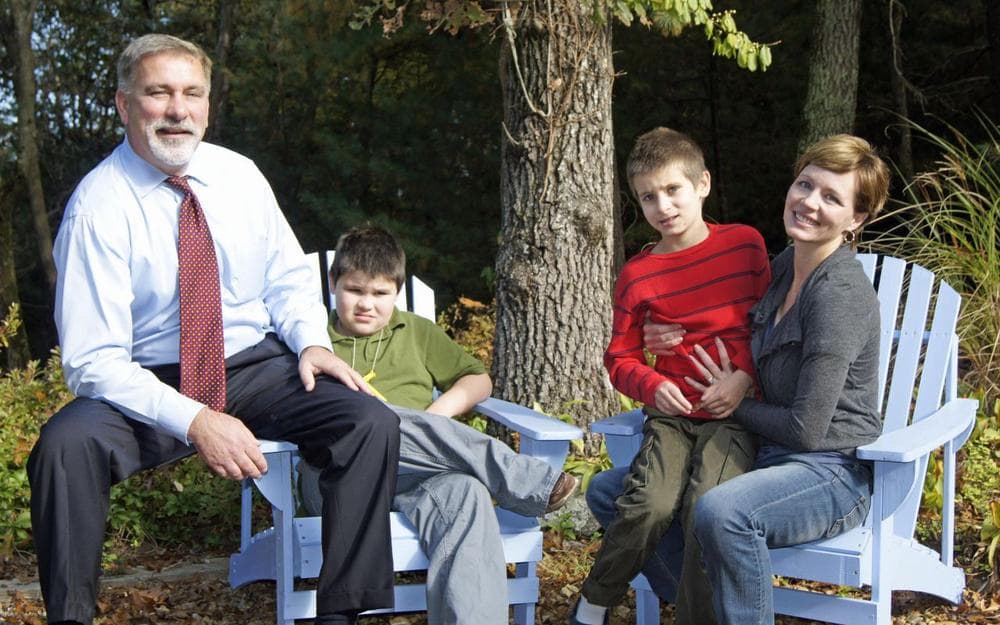 The Supple family outside their home in Natick. (Lynn Jolicoeur/WBUR)