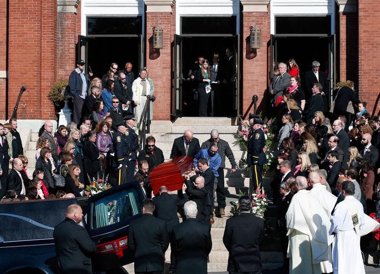 Mourners line the steps of St. Augustine Church in Andover Monday, as the casket of slain Danvers High School teacher Colleen Ritzer is carried out from her funeral Mass. (Elise Amendola/AP)