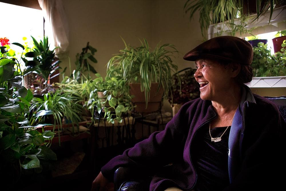 Myrtle Ho-Sang among the many plants in her house (Jesse Costa/WBUR)
