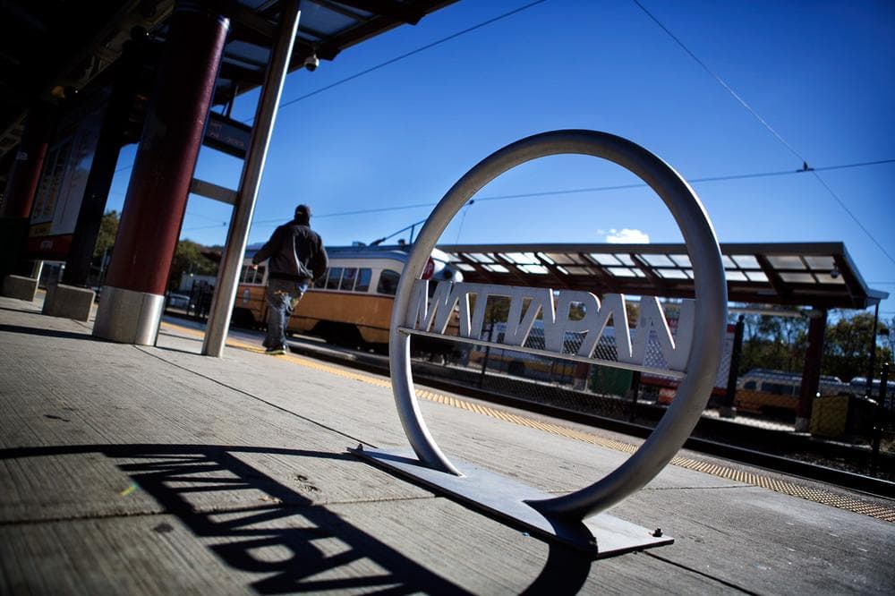 A man hurries to board an MBTA streetcar at Mattapan station. (Jesse Costa/WBUR)