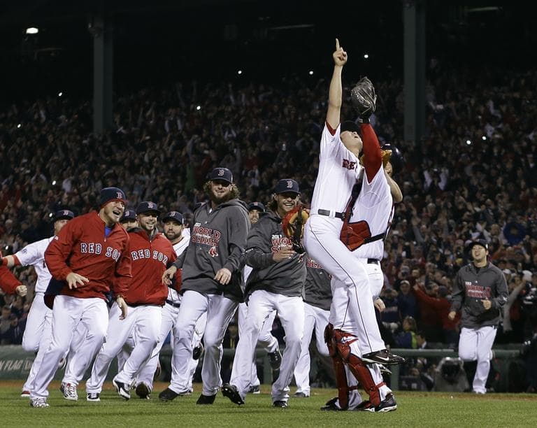Boston Red Sox relief pitcher Koji Uehara and catcher David Ross celebrate after getting St. Louis Cardinals' Matt Carpenter to strike out and Game 6 the World Series. (Matt Slocum/AP)