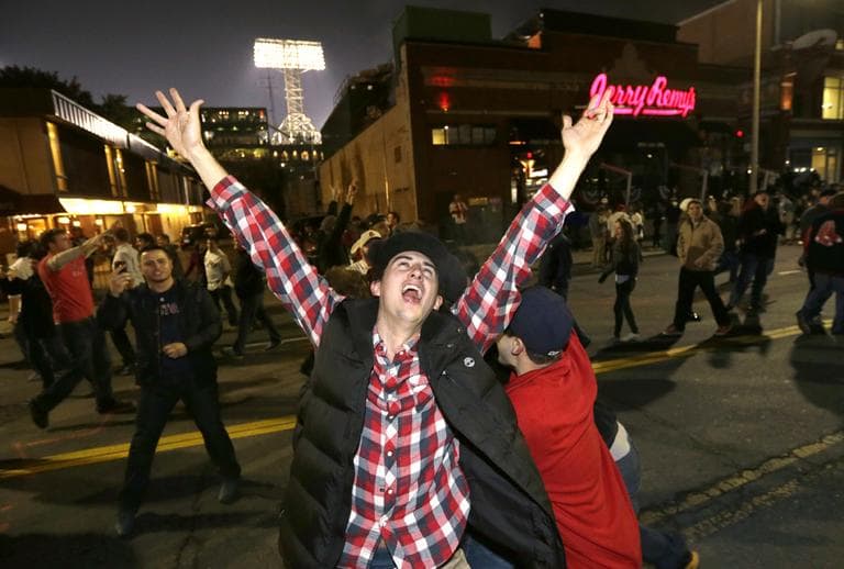 Red Sox fans celebrate in the street near Fenway Park. (Steven Senne/AP)