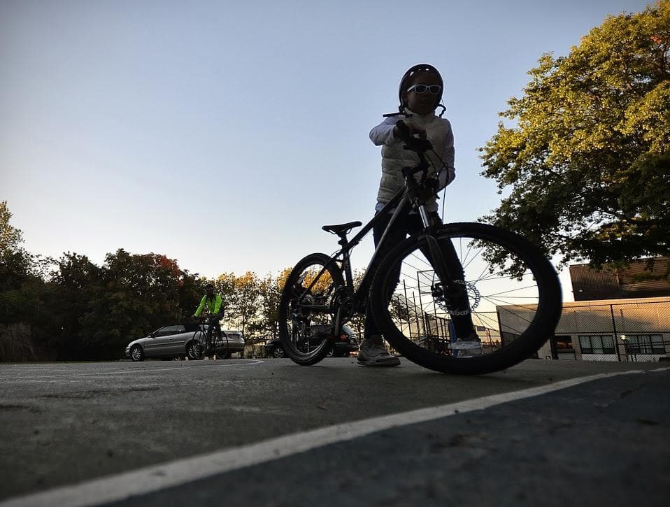A child bikes near Dudley Square in this 2013 file photo. (Alex Kingsbury/WBUR)