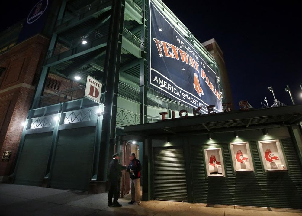 Security personnel stand outside Gate D at Fenway Park in Boston, Tuesday, Oct. 29, 2013. If the Boston Red Sox are able to win the baseball World Series at Fenway Park, police and city officials want to make sure fans celebrate responsibly. Boston holds a 3-2 lead over the St. Louis Cardinals with Game 6 and if necessary Game 7 scheduled at Fenway for Wednesday and Thursday nights. Police plan to put extra patrols on duty to guard against any unruly celebrations. (AP)